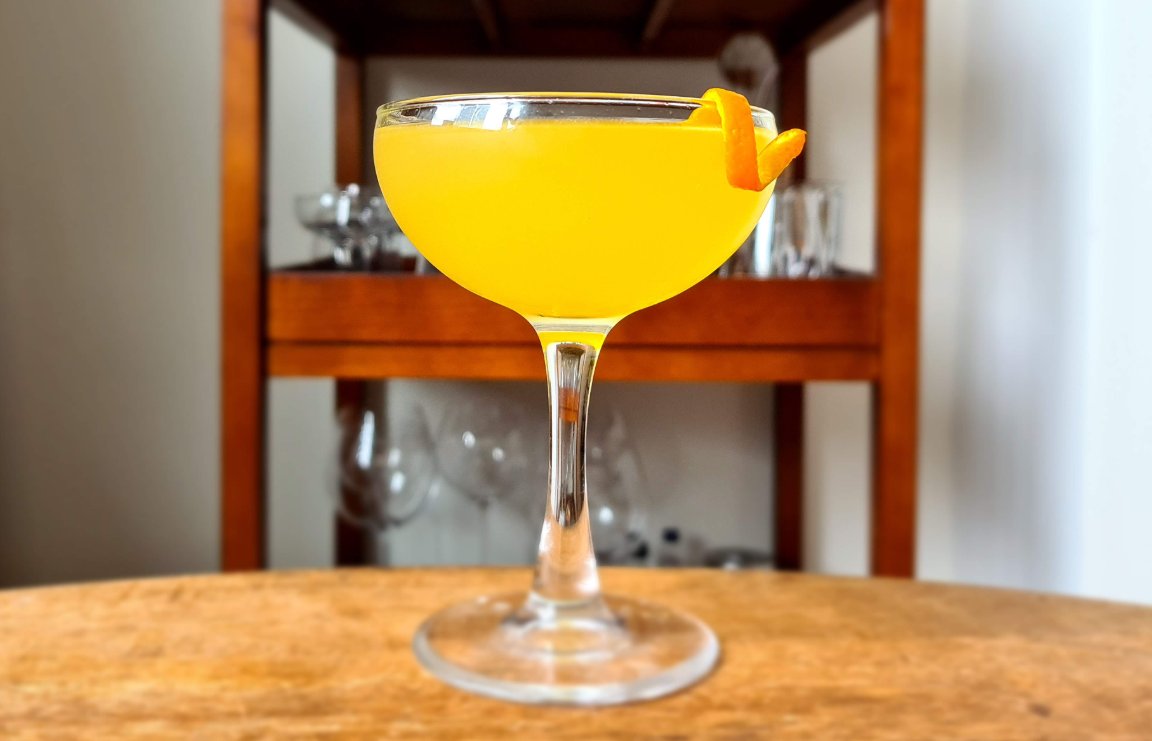 Orange Daiquiri cocktail in coupe glass